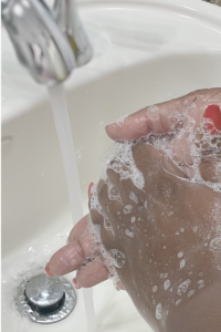 Washing hands at sink